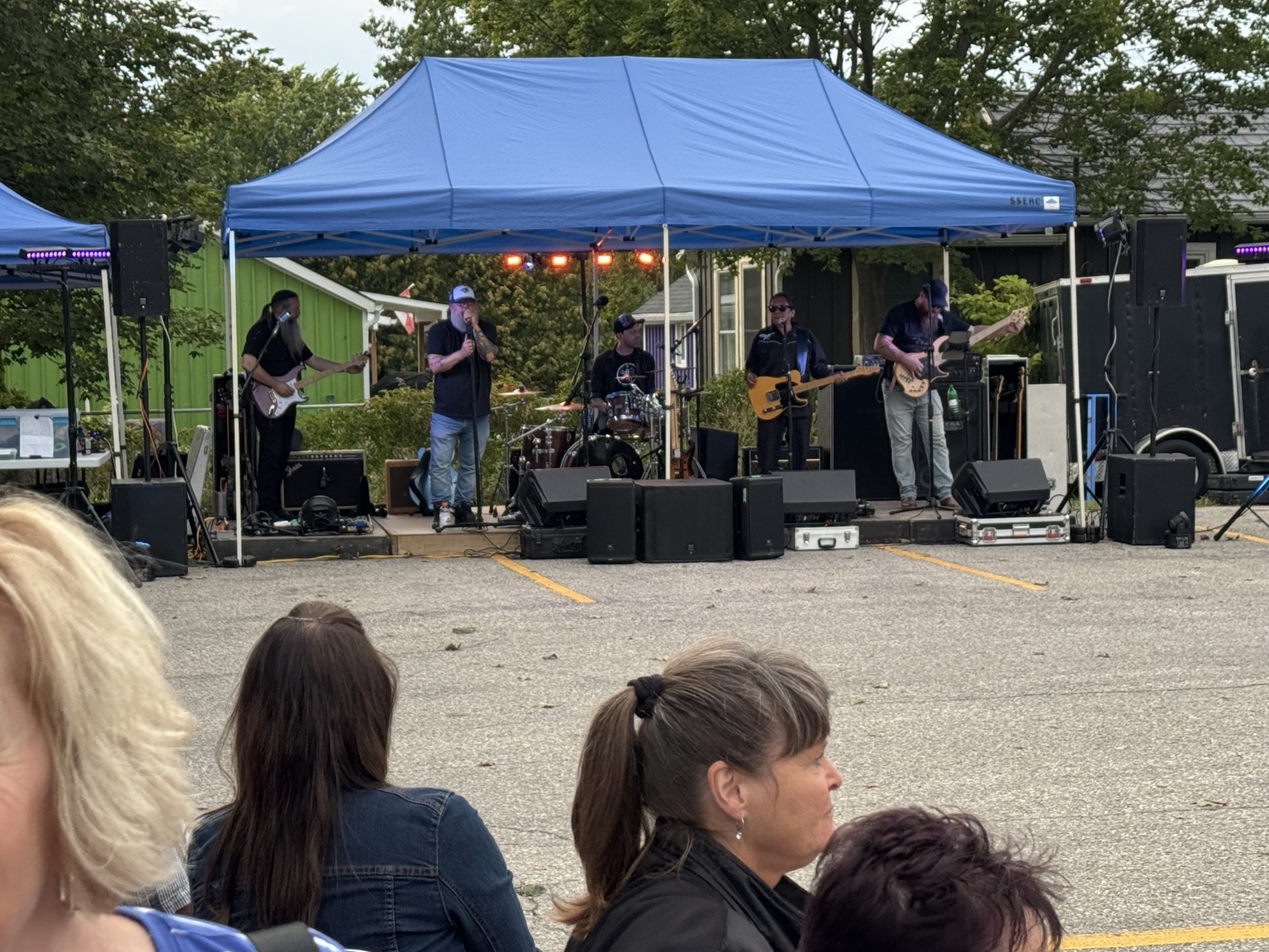 The band playing live music at the Legion Parking Lot Party 2026